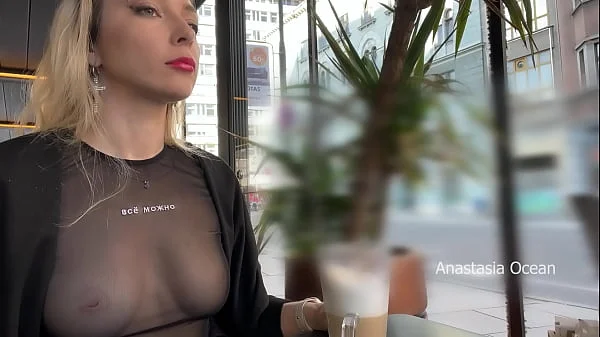 Flashing tits in cafe with glass walls so all people outside see me. Transparent t-shirt no bra.