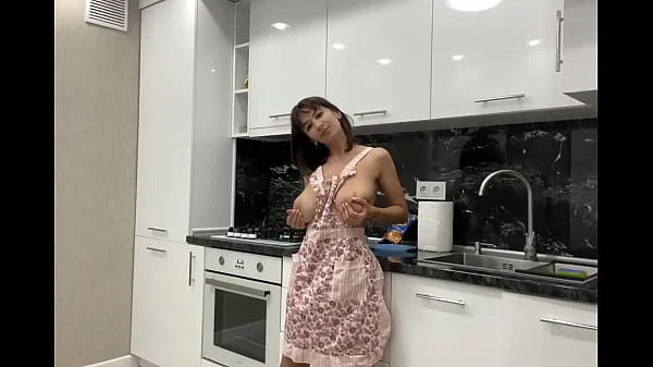 Stunning busty bitch masturbates in the kitchen before her lover arrives