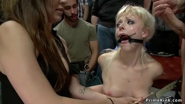 Gagged blonde is fucked in public