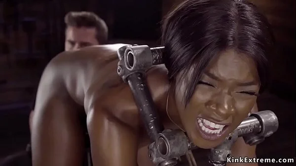 Ebony in device bondage is toyed