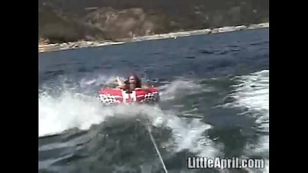 Sexy teen Little April playing with her snatch outdoors in rubber boat