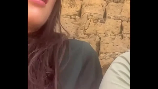 Two lesbians touch each other to orgasm on the corner of a town trying to avoid being seen by anyone